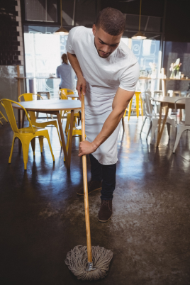 waiter-mopping-floor-in-cafe-DTJGV5P